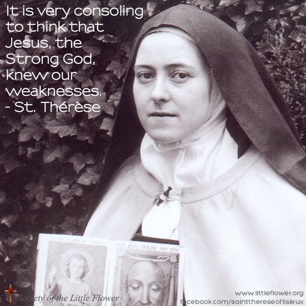 St. Therese holding a print of the Holy Face in the garden.