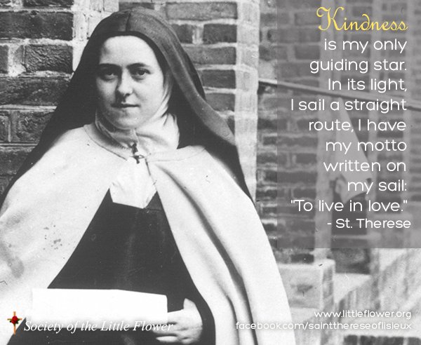 St. Therese standing before a brick wall.