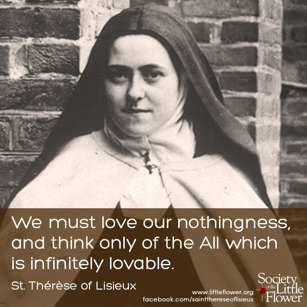 Photo detail of St. Therese of Lisieux standing near the brick wall in the courtyard at Le Carmel, Lisieux France.