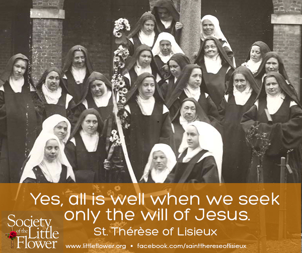 Group photo of all the sisters at Le Carmel monastery, surrounding the outdoor crucifix in the courtyard.  St. Therese is sitting on the lower left.