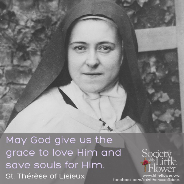 Photo detail of St. Therese of Lisieux standing near the brick wall in the courtyard at Le Carmel, Lisieux France.
