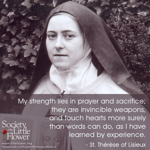Detail of photo of St. Therese of Lisieux holding the image of the Holy Face, in the garden at the Le Carmel monastery.
