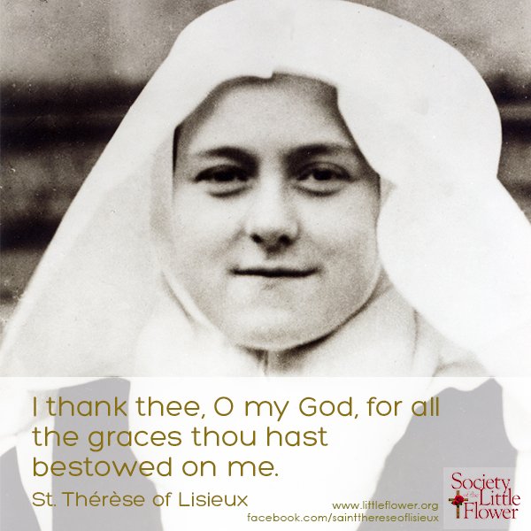 Detail of photo of St. Therese of Lisieux as a novice, embracing the large crucifix in the courtyard at Le Carmel monastery.