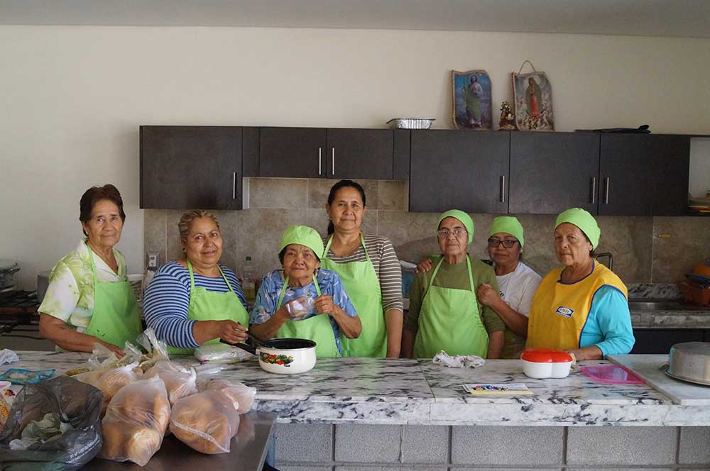 Elijah's Table volunteer's prepare food for the community