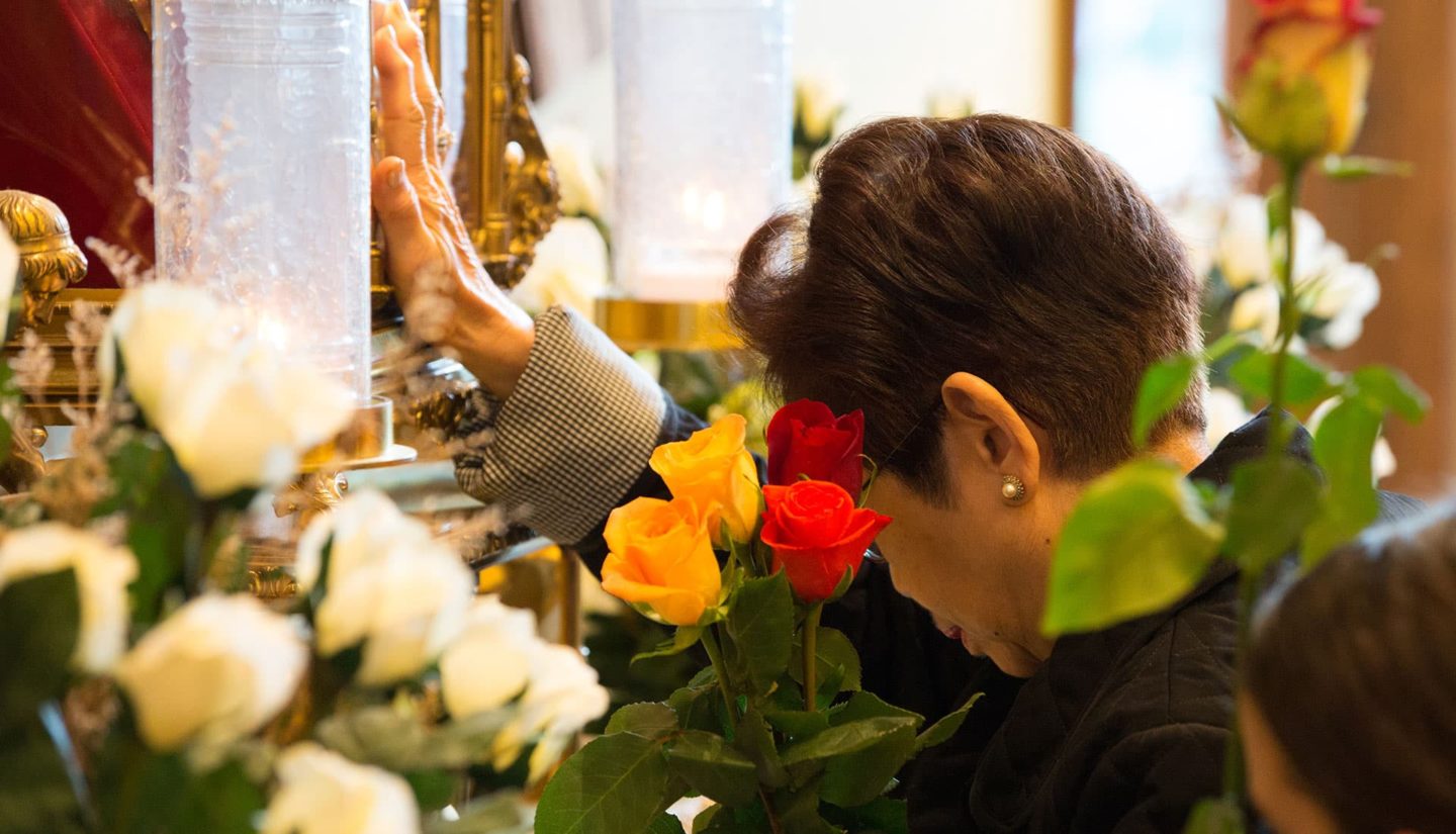 Praying at the Reliquary of St. Therese