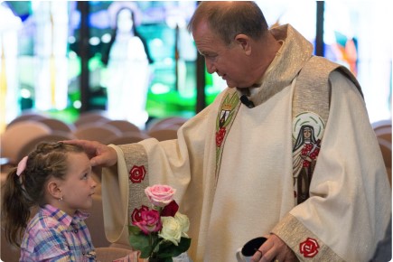 Fr. Bob and child