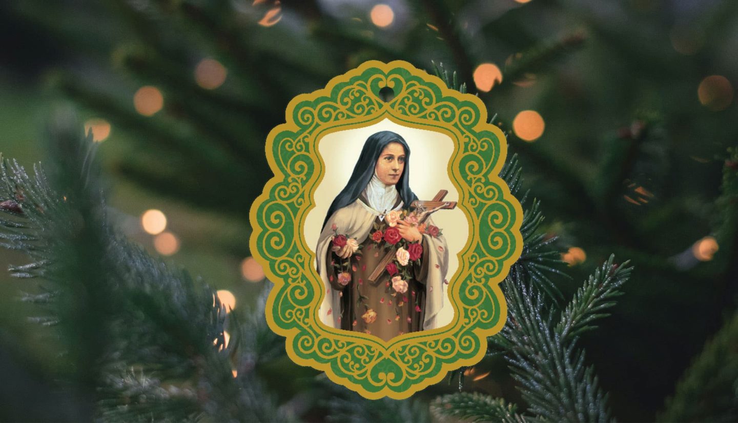 St. Therese ornament in front of softly lit Christmas Tree