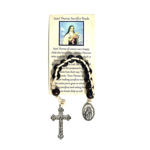 String of brown beads with a silver medal of St Therese on one end and a silver Cross on the other end