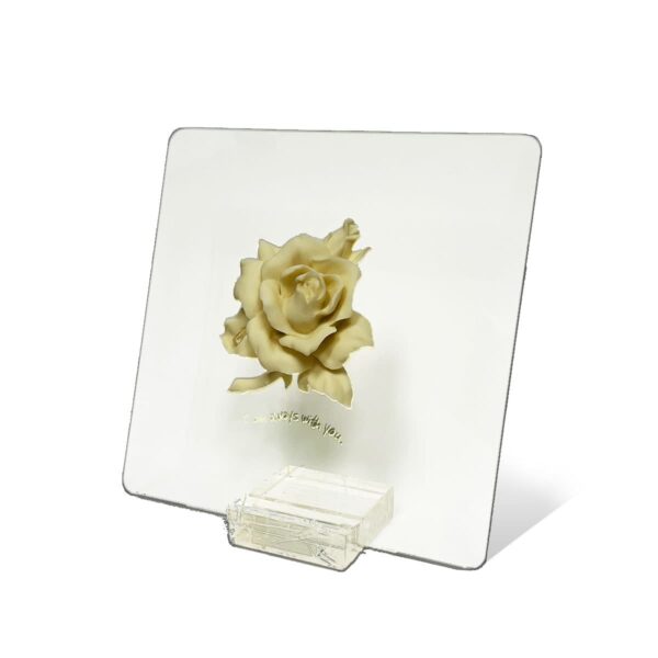 glass plaque with white rose in the center