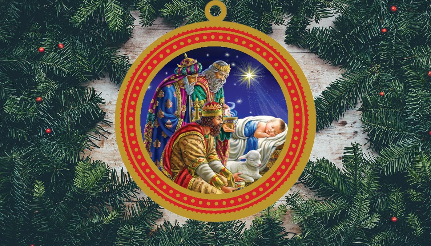 Wisemen offering gifs to Jesus ornament inside Christmas greenery