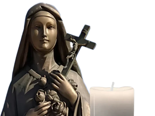 Bronze statue of St. Therese with a candle