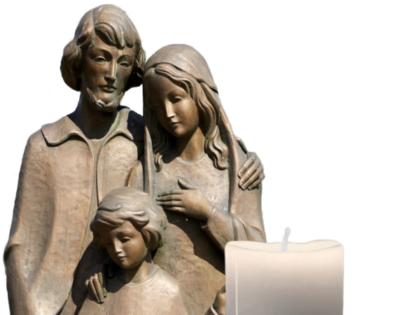 Bronze statue of the Holy Family with a candle