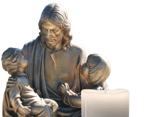 Bronze statue of Jesus with the Children with a candle