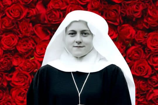 Black and white image of St. Therese in front of roses